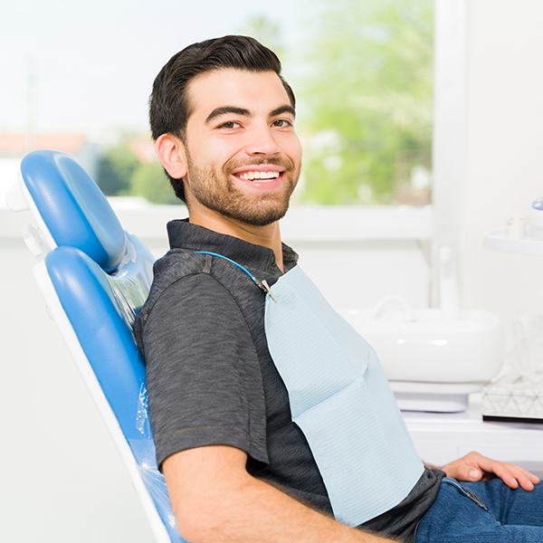 A mature man with dental implants smiling